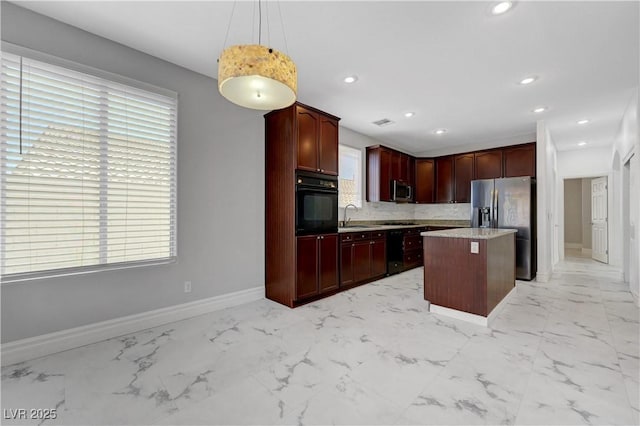 3079 Evening Mist Ave, Henderson, NV 89052 - kitchen featuring black appliances, a kitchen island, light marble finish flooring, pendant lighting, and recessed lighting