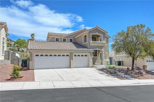 3079 Evening Mist Ave, Henderson, NV 89052 - mediterranean / spanish-style home with a tiled roof, an attached garage, stucco siding, and concrete driveway