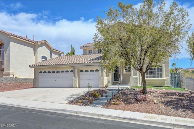 3079 Evening Mist Ave, Henderson, NV 89052 - view of front of house with an attached garage, concrete driveway, stucco siding, and a tiled roof