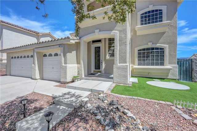 3079 Evening Mist Ave, Henderson, NV 89052 - view of front of home featuring stucco siding, an attached garage, and driveway