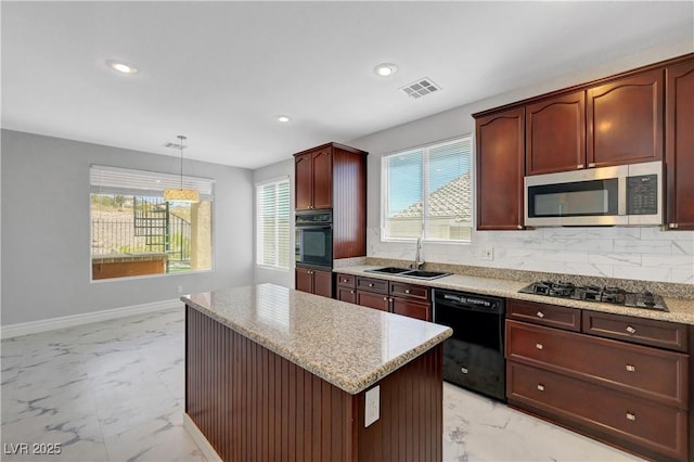 3079 Evening Mist Ave, Henderson, NV 89052 - kitchen featuring black appliances, light marble finish floors, recessed lighting, decorative backsplash, and a kitchen island