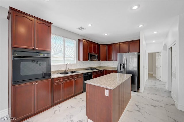3079 Evening Mist Ave, Henderson, NV 89052 - kitchen with black appliances, light marble finish flooring, tasteful backsplash, a kitchen island, and recessed lighting