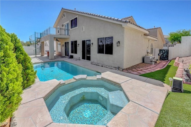 3079 Evening Mist Ave, Henderson, NV 89052 - rear view of house with stairs, stucco siding, a pool with connected hot tub, a patio, and a tile roof