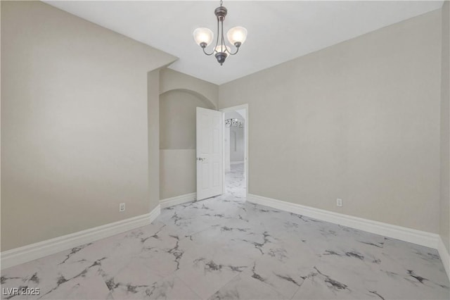 3079 Evening Mist Ave, Henderson, NV 89052 - unfurnished room with marble finish floors and a chandelier