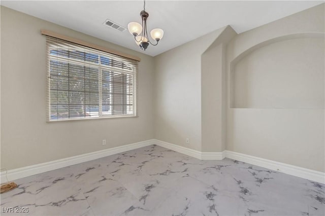 3079 Evening Mist Ave, Henderson, NV 89052 - unfurnished room with marble finish floors and a chandelier