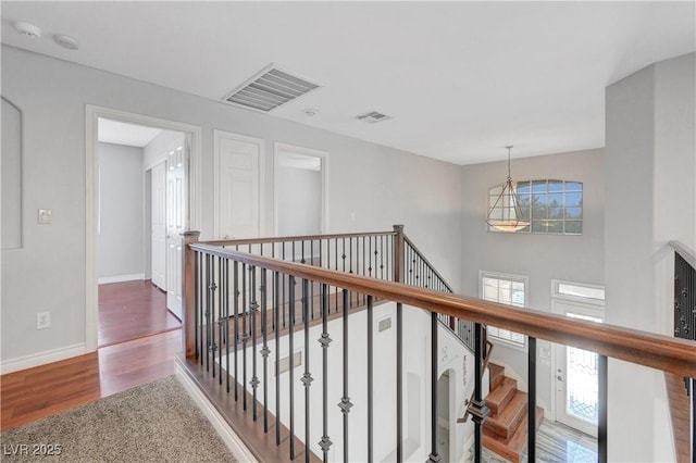 3079 Evening Mist Ave, Henderson, NV 89052 - hallway featuring plenty of natural light, wood finished floors, and an upstairs landing
