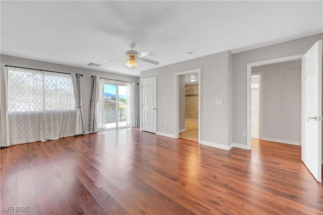 3079 Evening Mist Ave, Henderson, NV 89052 - unfurnished bedroom featuring wood finished floors, access to exterior, and a ceiling fan