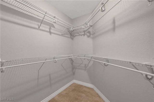 3079 Evening Mist Ave, Henderson, NV 89052 - walk in closet with light tile patterned floors