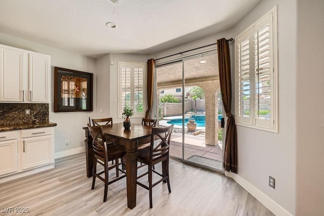 6103 Sundown Crest St, Las Vegas, NV 89113 - dining room featuring baseboards and light wood finished floors