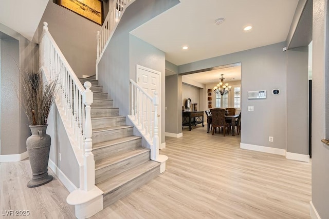 6103 Sundown Crest St, Las Vegas, NV 89113 - stairs with wood finished floors, a chandelier, and recessed lighting