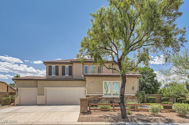 6103 Sundown Crest St, Las Vegas, NV 89113 - mediterranean / spanish-style house with stucco siding, concrete driveway, stone siding, a tiled roof, and an attached garage