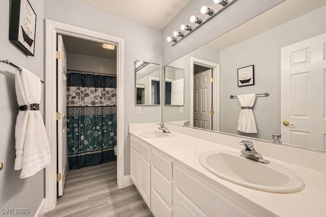 6103 Sundown Crest St, Las Vegas, NV 89113 - bathroom featuring double vanity and wood finished floors