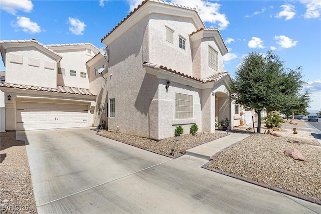 5967 Aimless St, Henderson, NV 89011 - view of front of house featuring stucco siding, concrete driveway, and a tiled roof