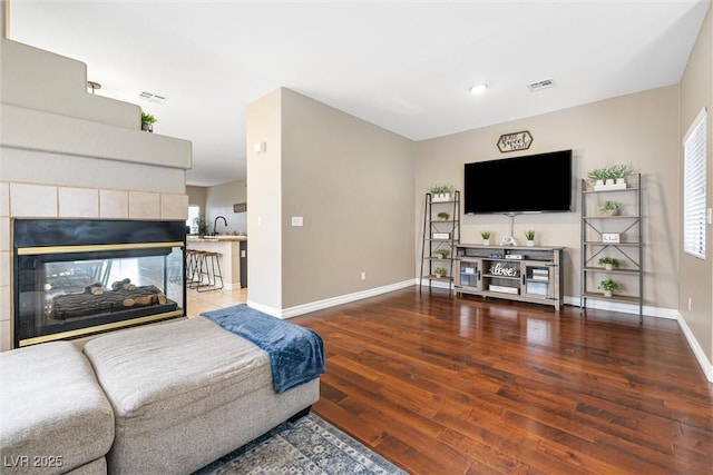 5967 Aimless St, Henderson, NV 89011 - living room with wood finished floors and healthy amount of natural light