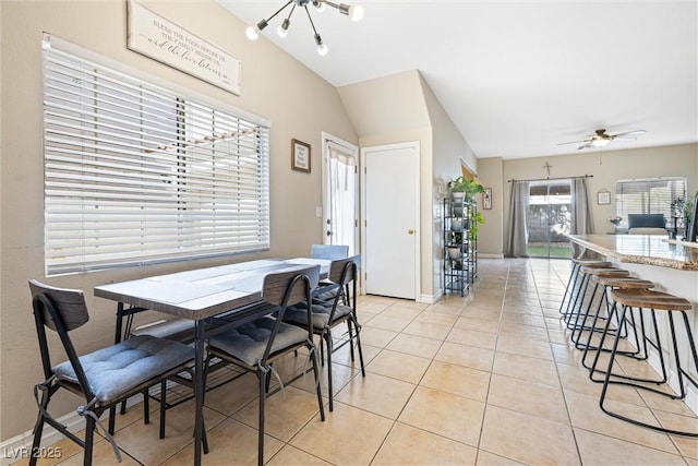 5967 Aimless St, Henderson, NV 89011 - dining space featuring light tile patterned floors, a chandelier, a ceiling fan, and lofted ceiling