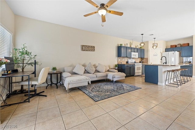 5967 Aimless St, Henderson, NV 89011 - living room with light tile patterned floors and ceiling fan