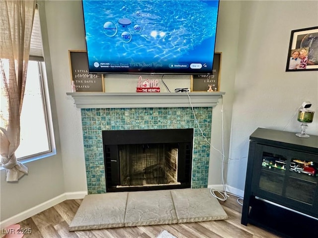 2016 Mesquite Ln Unit 302, Laughlin, NV 89029 - detailed view of wood finished floors and a tiled fireplace
