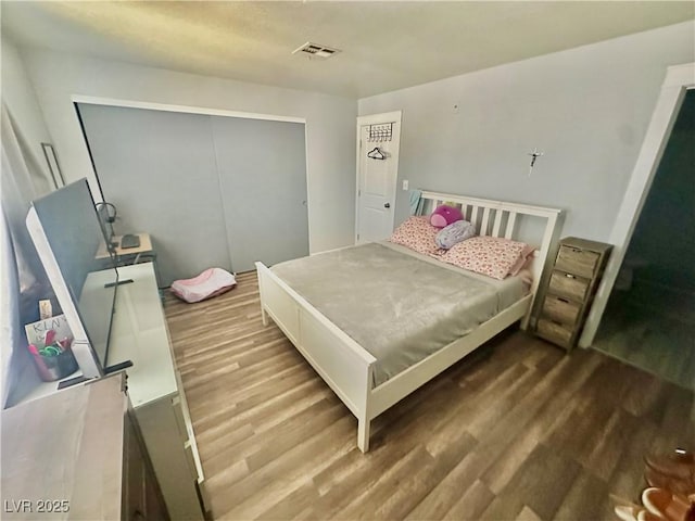 2016 Mesquite Ln Unit 302, Laughlin, NV 89029 - bedroom featuring wood finished floors and a closet