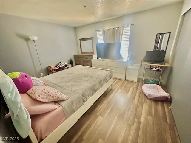 2016 Mesquite Ln Unit 302, Laughlin, NV 89029 - bedroom with wood finished floors and a textured ceiling