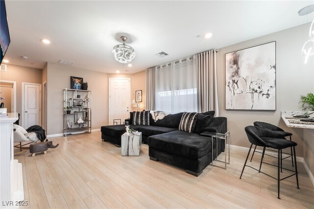 2845 Mincio St, Henderson, NV 89044 - living room featuring light wood-style flooring and recessed lighting