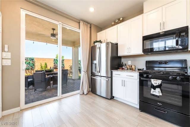 2845 Mincio St, Henderson, NV 89044 - kitchen featuring black appliances, light wood finished floors, white cabinets, a ceiling fan, and recessed lighting