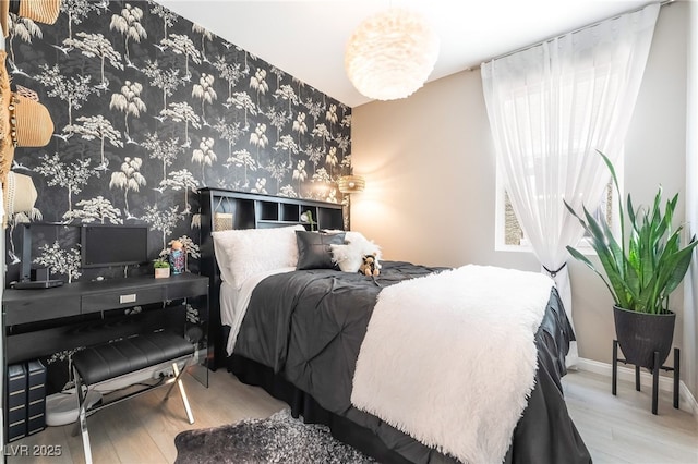 2845 Mincio St, Henderson, NV 89044 - bedroom with wood finished floors, wallpapered walls, and an accent wall