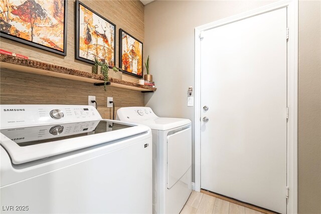 2845 Mincio St, Henderson, NV 89044 - washroom featuring washing machine and clothes dryer and light wood finished floors