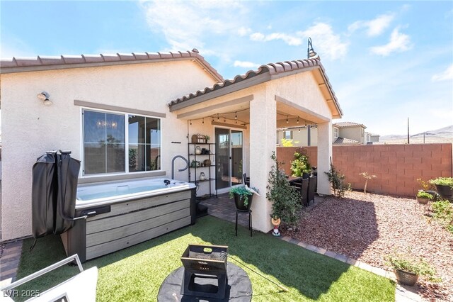 2845 Mincio St, Henderson, NV 89044 - back of property with a hot tub, stucco siding, and a patio