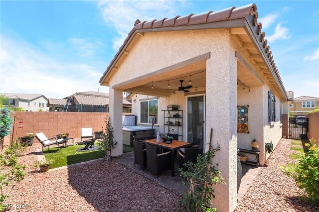 2845 Mincio St, Henderson, NV 89044 - back of property featuring stucco siding, a patio, a fenced backyard, and a ceiling fan