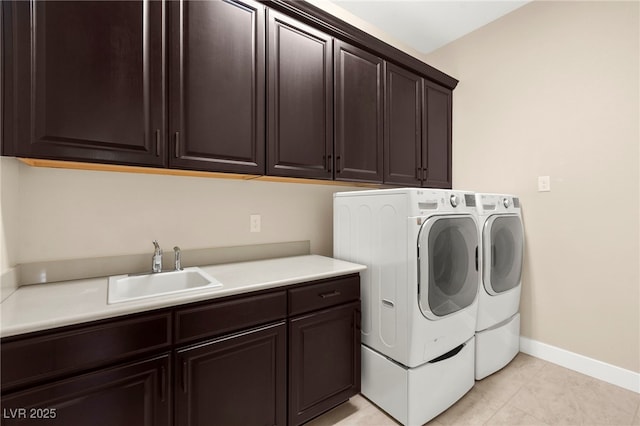 6810 Silver Crescent St, Las Vegas, NV 89148 - laundry room featuring cabinet space, separate washer and dryer, and light tile patterned floors