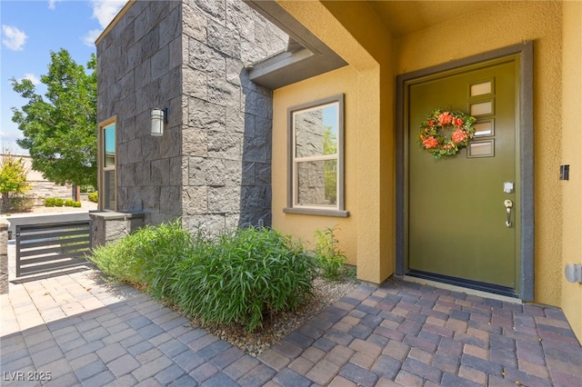 6810 Silver Crescent St, Las Vegas, NV 89148 - property entrance with stone siding and stucco siding