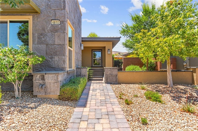 6810 Silver Crescent St, Las Vegas, NV 89148 - doorway to property featuring stone siding