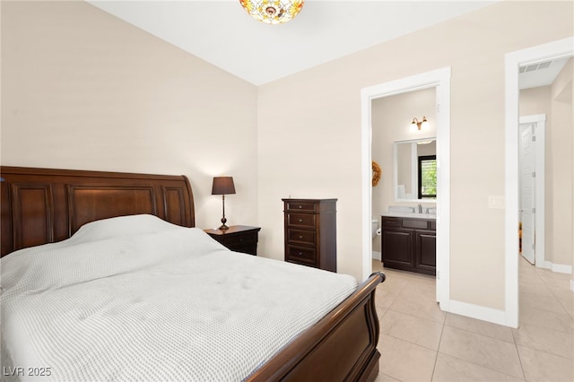 6810 Silver Crescent St, Las Vegas, NV 89148 - bedroom featuring light tile patterned flooring and ensuite bath