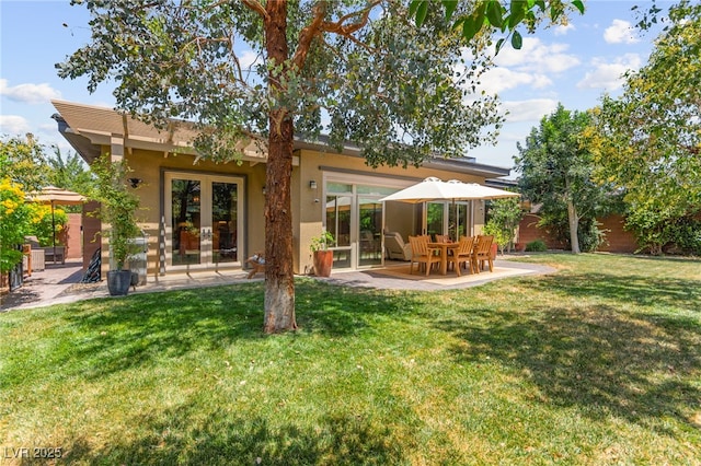 6810 Silver Crescent St, Las Vegas, NV 89148 - back of property with a patio area, a yard, and stucco siding