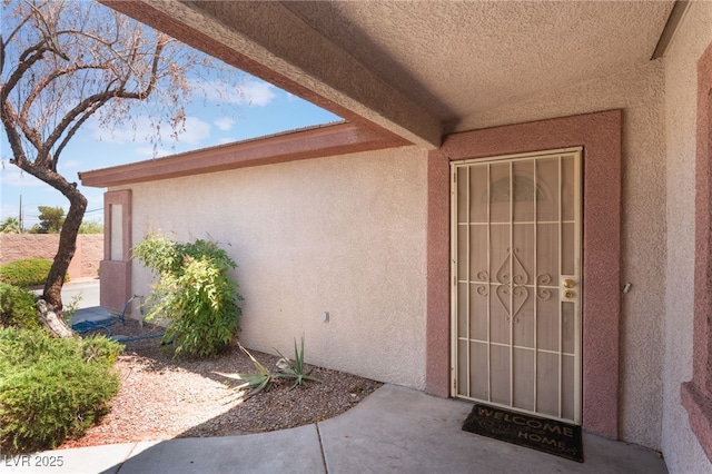 4656 E Desert Inn Rd, Las Vegas, NV 89121 - doorway to property featuring stucco siding