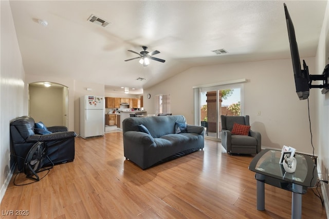 4656 E Desert Inn Rd, Las Vegas, NV 89121 - living area featuring lofted ceiling, a ceiling fan, arched walkways, and light wood-style flooring