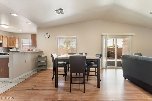 4656 E Desert Inn Rd, Las Vegas, NV 89121 - dining space with lofted ceiling, recessed lighting, and light wood finished floors
