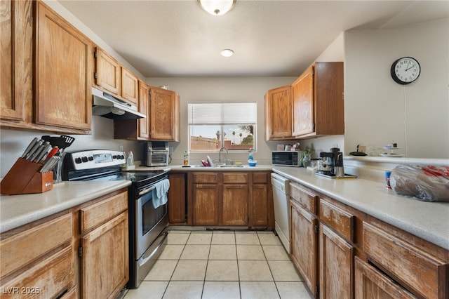4656 E Desert Inn Rd, Las Vegas, NV 89121 - kitchen with stainless steel electric range, under cabinet range hood, white dishwasher, light tile patterned flooring, and light countertops