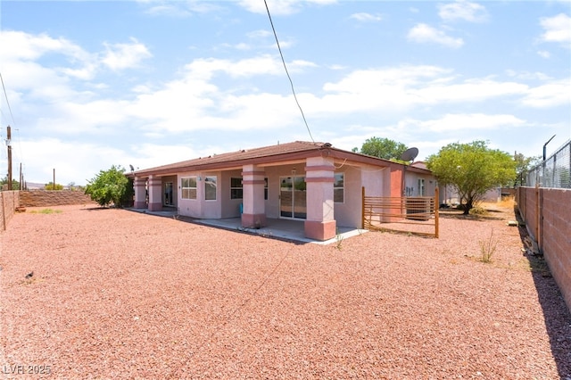4656 E Desert Inn Rd, Las Vegas, NV 89121 - back of property with a patio area, a fenced backyard, and stucco siding