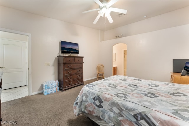 4656 E Desert Inn Rd, Las Vegas, NV 89121 - carpeted bedroom featuring arched walkways, a ceiling fan, and tile patterned floors