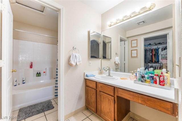 4656 E Desert Inn Rd, Las Vegas, NV 89121 - full bathroom featuring tile patterned floors, shower / washtub combination, vanity, and a walk in closet