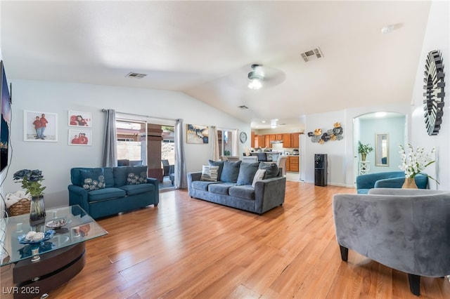 4656 E Desert Inn Rd, Las Vegas, NV 89121 - living area featuring arched walkways, lofted ceiling, light wood-style flooring, and ceiling fan