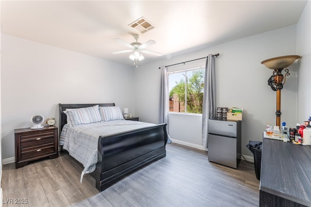 4656 E Desert Inn Rd, Las Vegas, NV 89121 - bedroom with wood finished floors and a ceiling fan