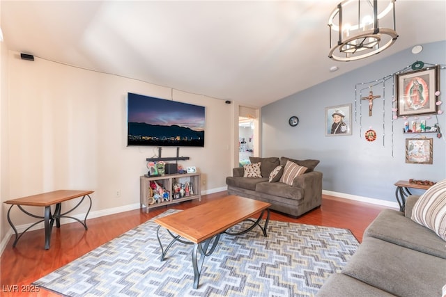 4656 E Desert Inn Rd, Las Vegas, NV 89121 - living area featuring vaulted ceiling, wood finished floors, and a chandelier