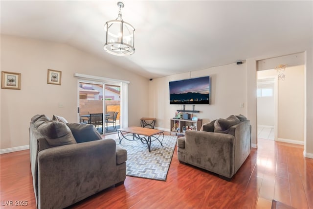 4656 E Desert Inn Rd, Las Vegas, NV 89121 - living area featuring a chandelier, vaulted ceiling, and wood finished floors
