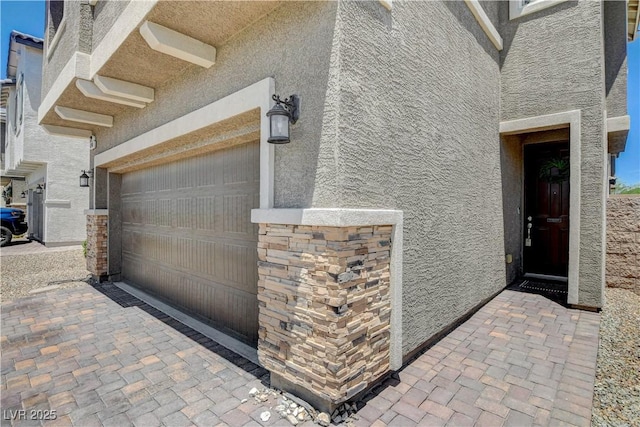 4240 Spring Storm Ave, North Las Vegas, NV 89081 - view of property exterior with stucco siding and an attached garage