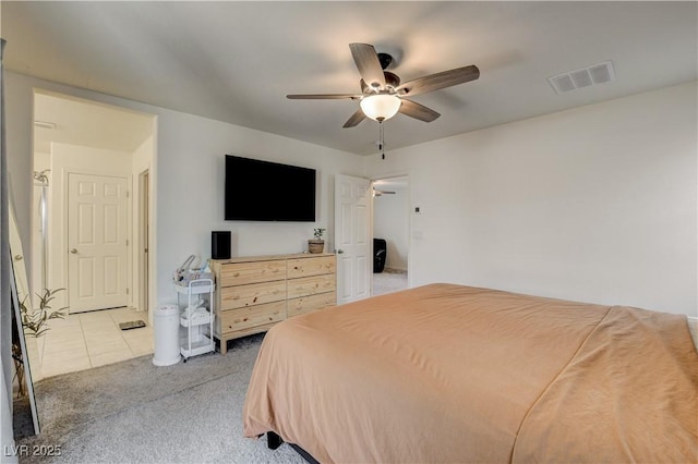 4240 Spring Storm Ave, North Las Vegas, NV 89081 - tiled bedroom with carpet flooring and ceiling fan