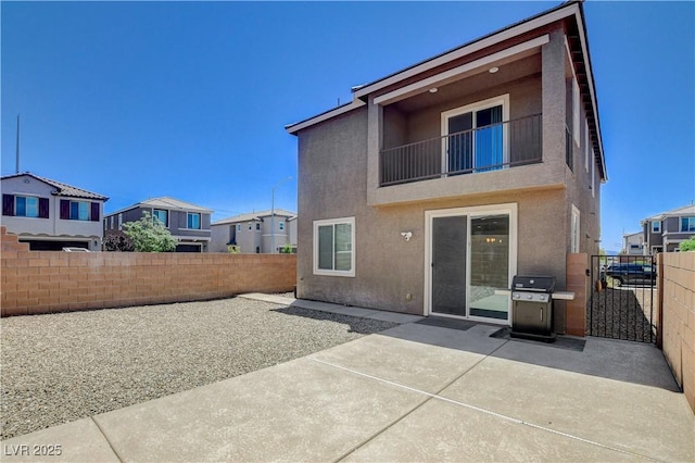 4240 Spring Storm Ave, North Las Vegas, NV 89081 - rear view of house with stucco siding, a fenced backyard, a patio, and a gate