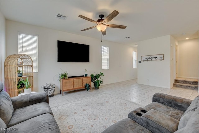 4240 Spring Storm Ave, North Las Vegas, NV 89081 - living area with light tile patterned floors and a ceiling fan