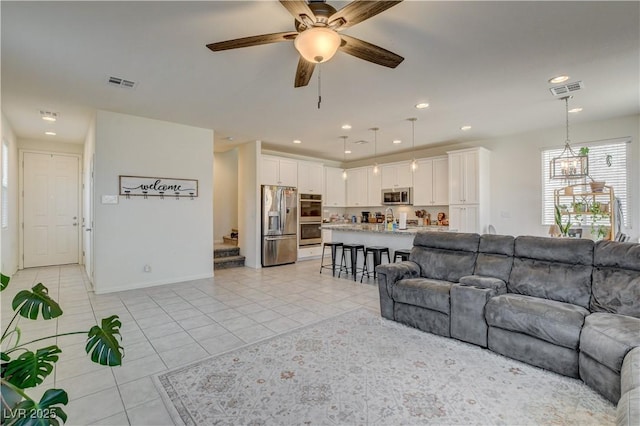 4240 Spring Storm Ave, North Las Vegas, NV 89081 - living room featuring light tile patterned floors, ceiling fan, and recessed lighting